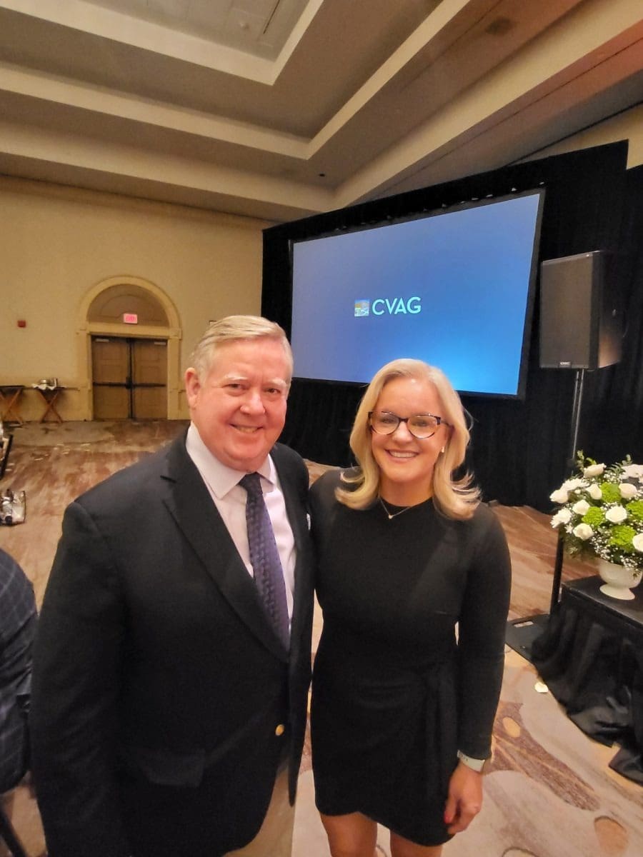 Smiling pair in conference setting