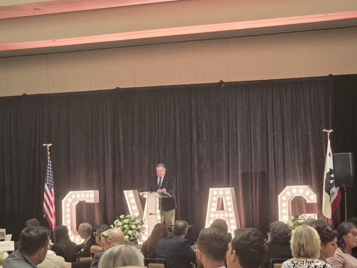 Speaker on stage at conference event