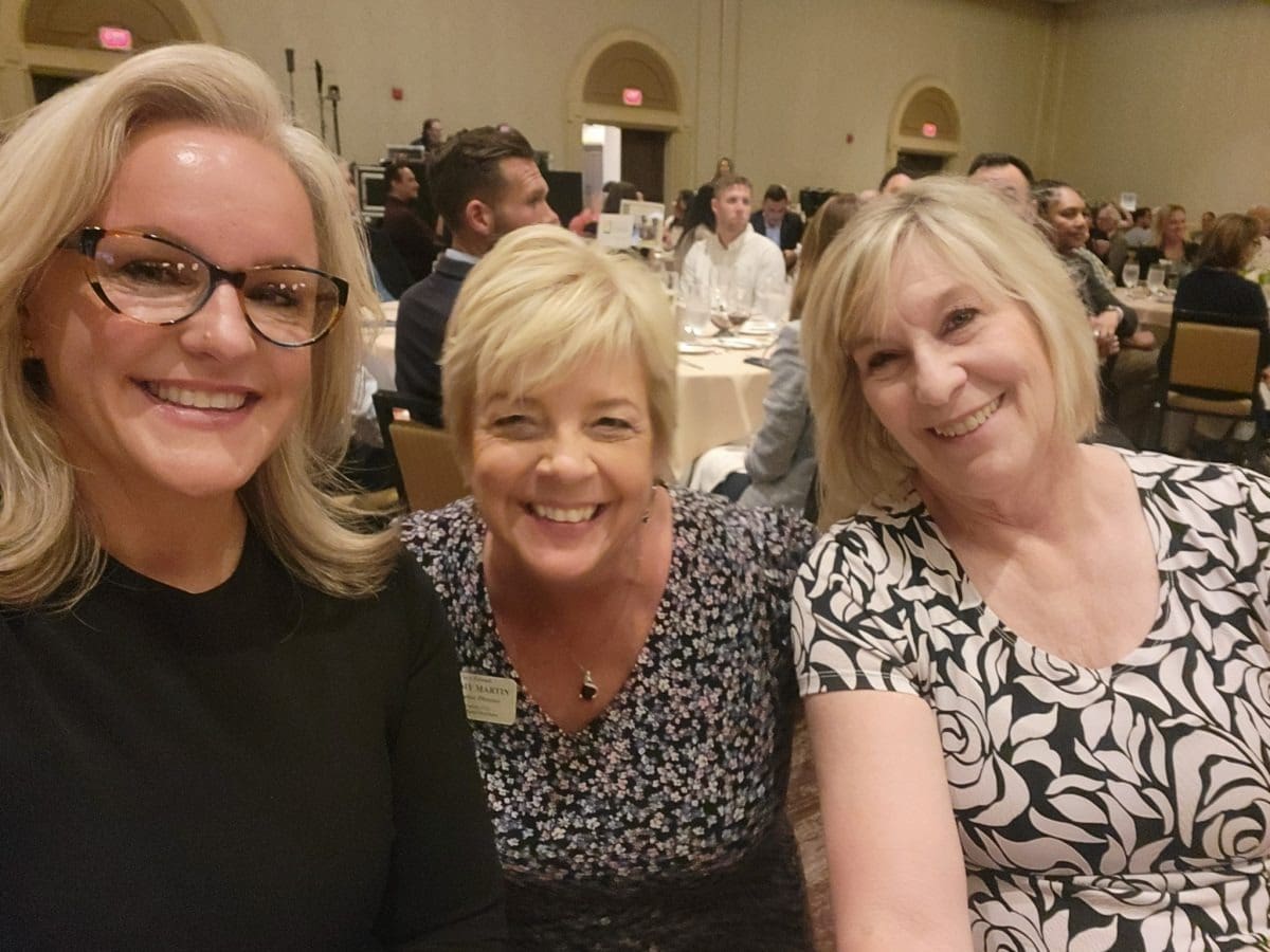 Group selfie at a banquet gathering