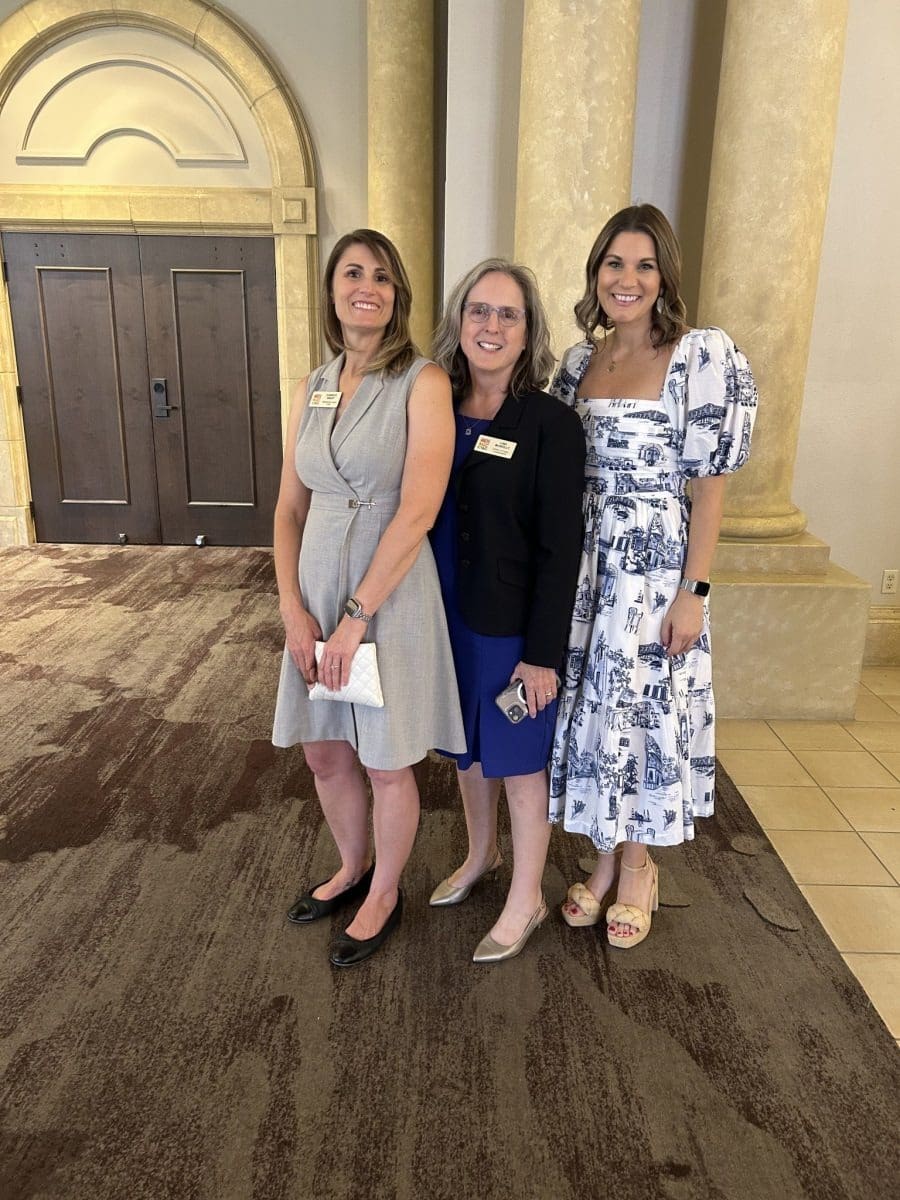 Smiling women posing indoors