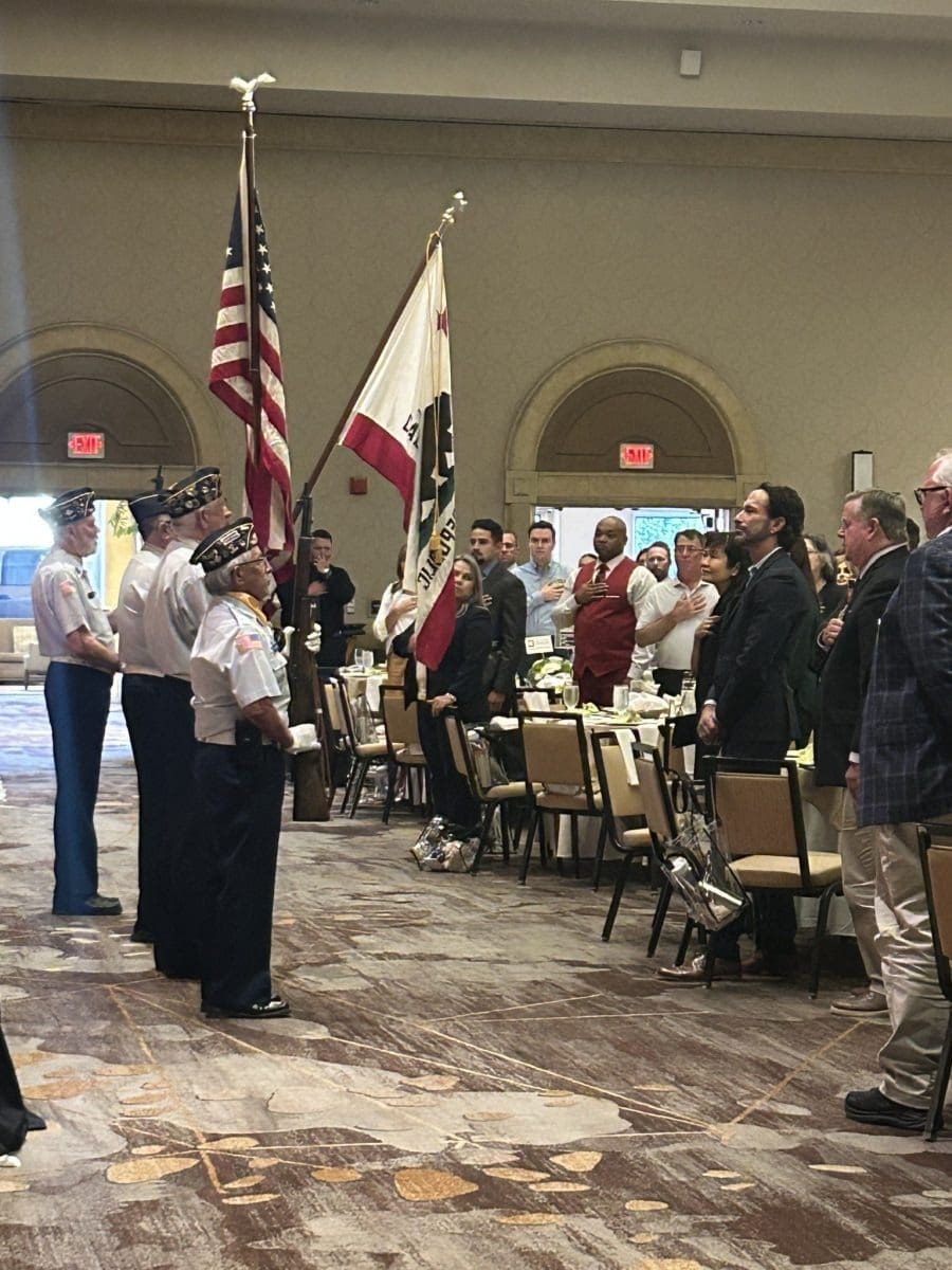 People standing during flag ceremony