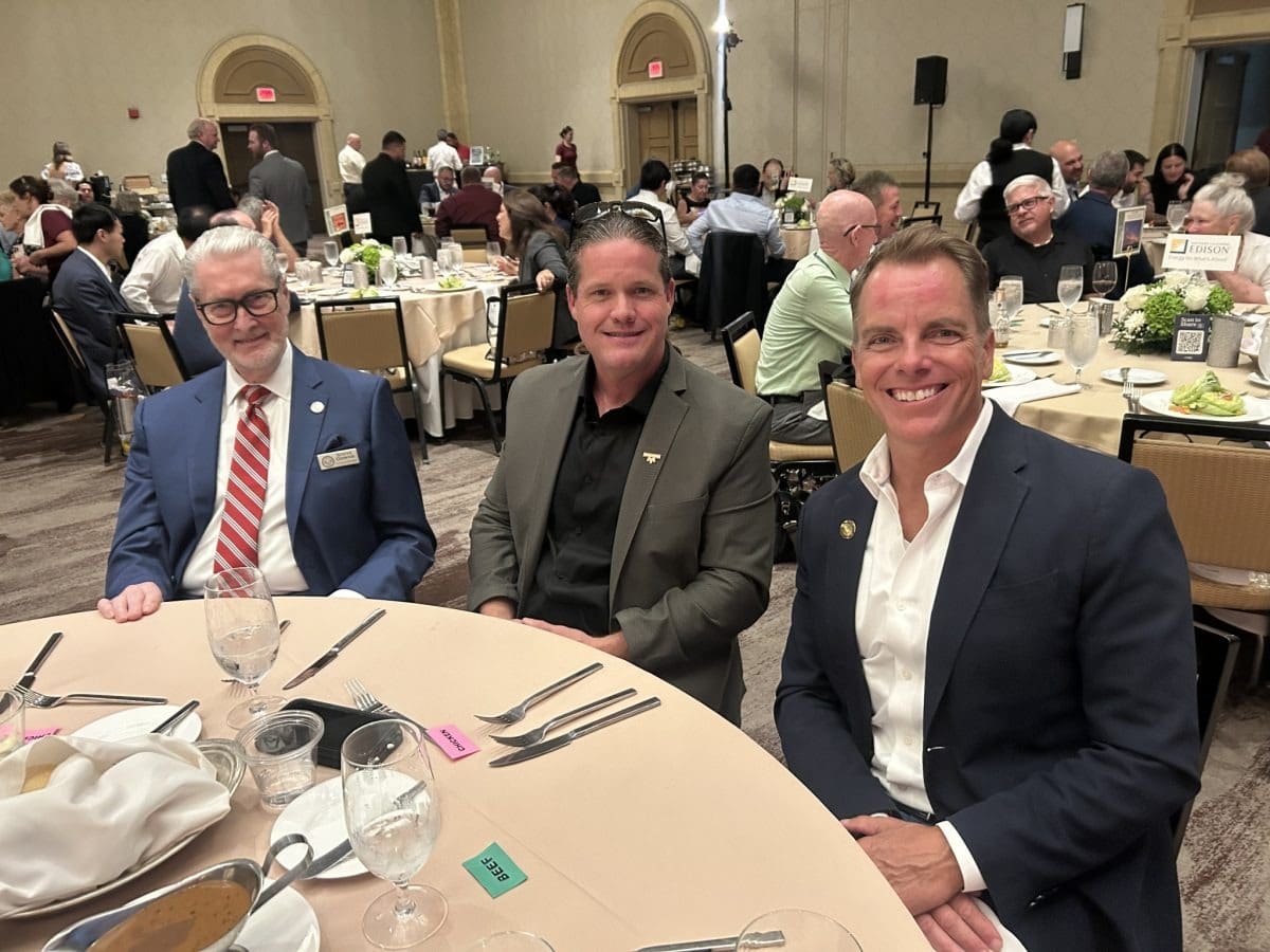 Smiling group at a banquet table.