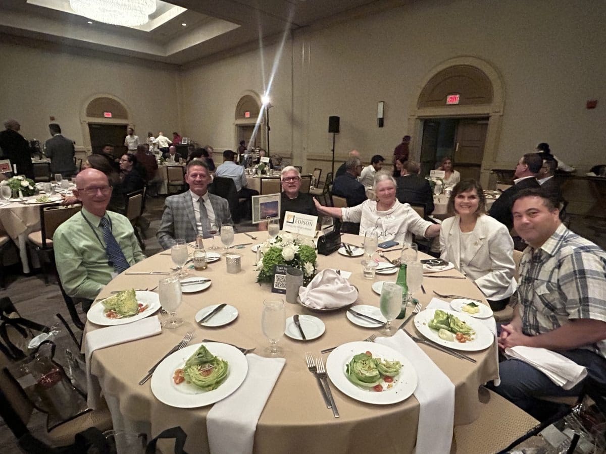 Guests seated with plated salads
