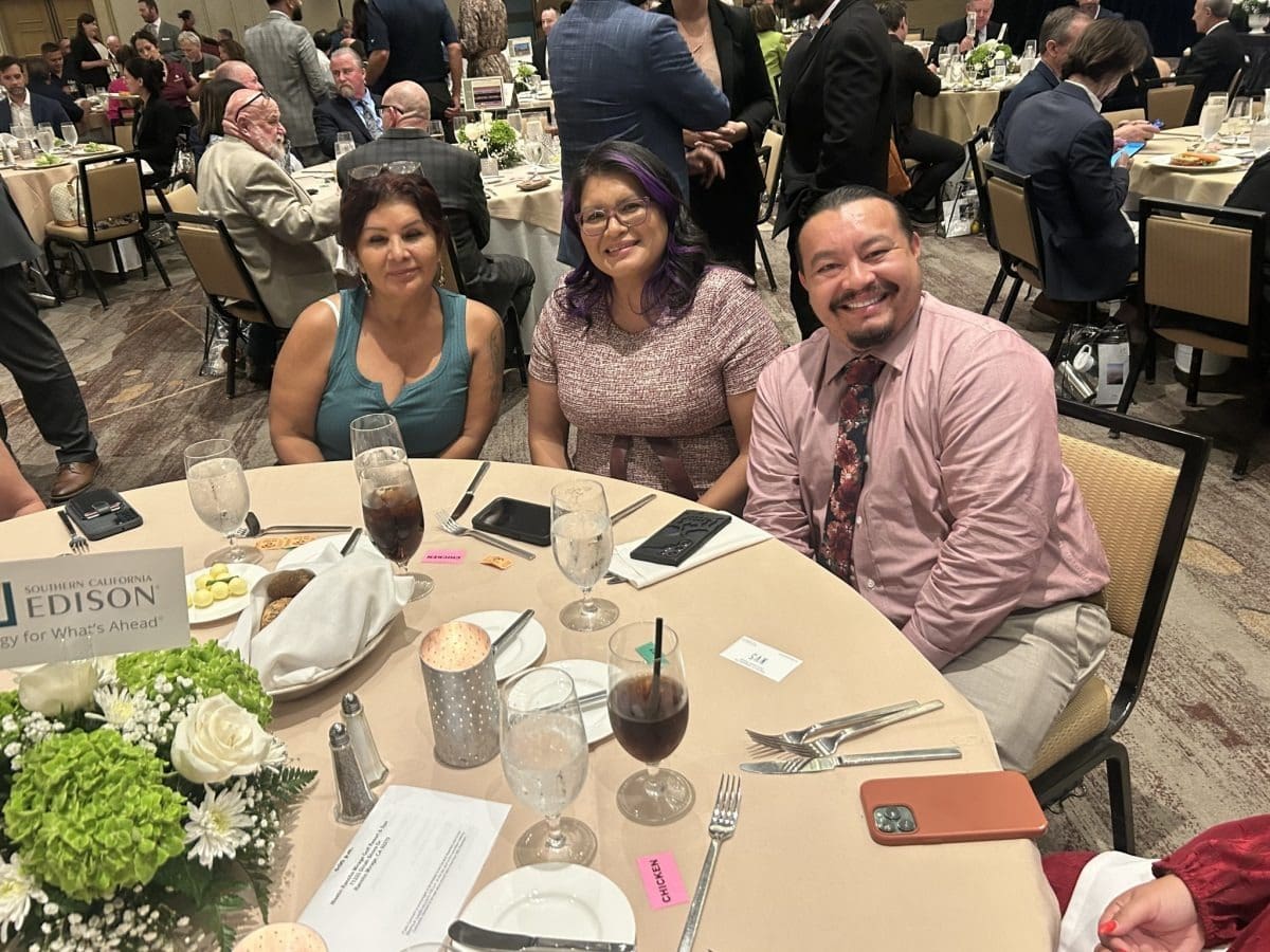 Smiling group at dining table